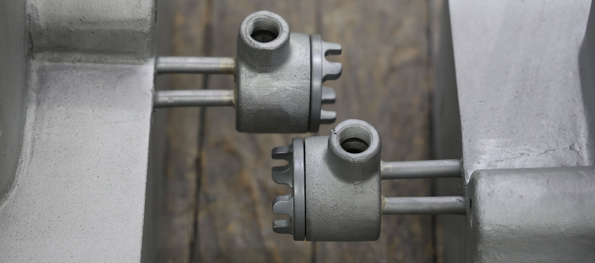 Industrial component threaded connections and mounting hardware detail view.