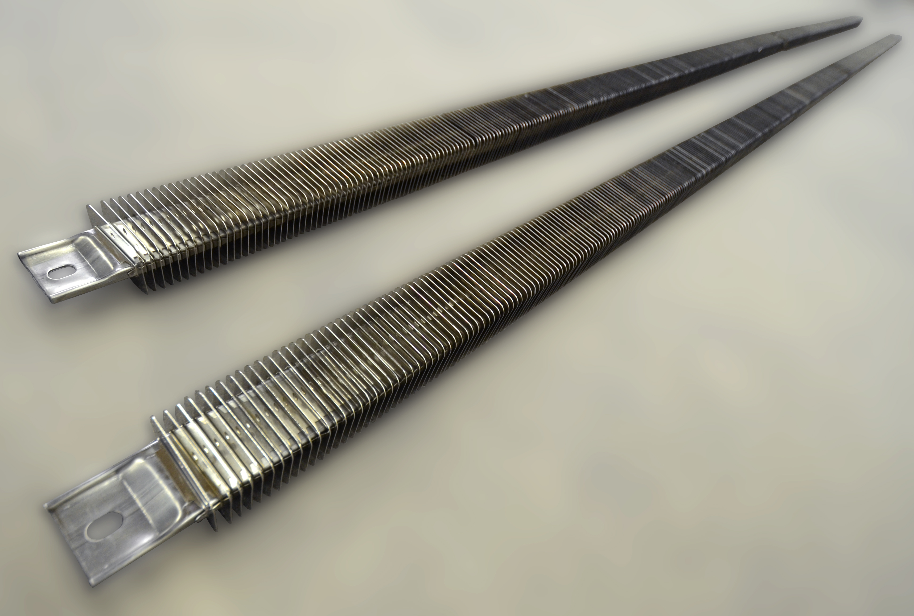 Two long finned channel strip heaters